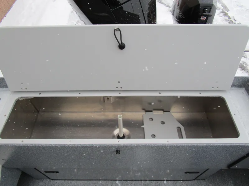 Slide: The Image of Open storage compartment on 2025 KingFisher Escape HT boat, showcasing interior design. - 41
