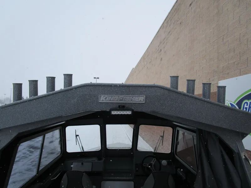 Slide: The Image of KingFisher 2025 Escape HT boat, exterior view in snowy setting. - 45