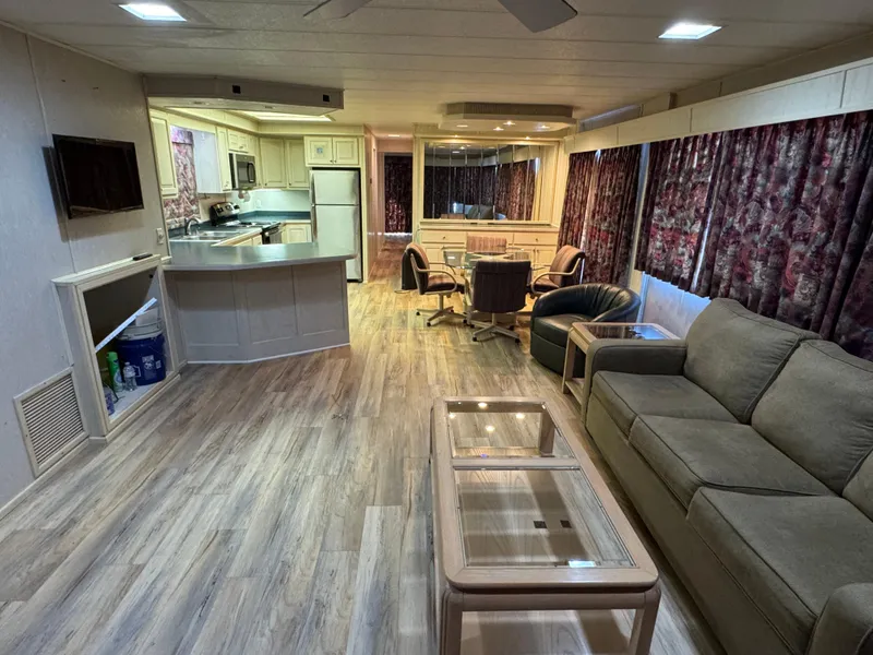 Slide: The Image of Interior of a 1996 Stardust Cruisers 72x16 houseboat with modern furnishings and open layout. - 15