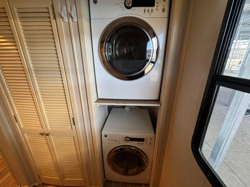 Slide: The Image of Stacked washer and dryer in 1996 Stardust Cruisers 72x16 houseboat laundry area. - 39