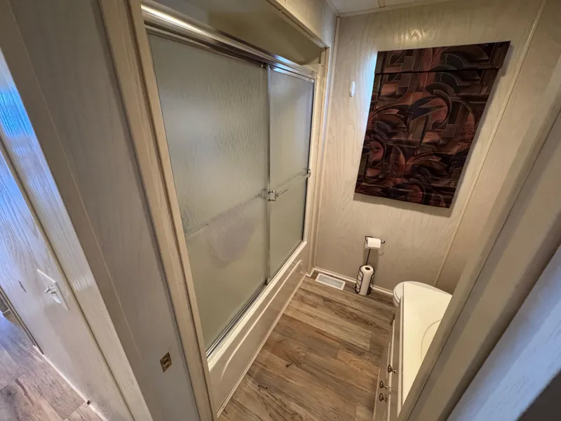 Slide: The Image of Bathroom interior of 1996 Stardust Cruisers 72x16 houseboat with shower and modern decor. - 44