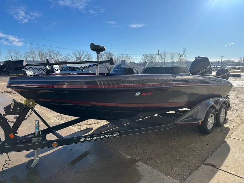 Slide: The Image of 2012 Ranger 619VS boat on trailer under clear blue sky. - 15