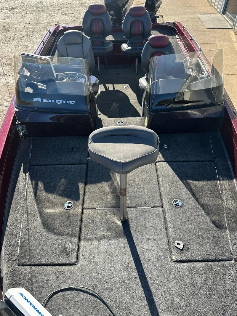 Slide: The Image of 2012 Ranger 619VS boat interior with seating and control panels. - 18