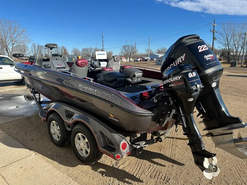 Slide: The Image of 2012 Ranger 619VS boat with dual Mercury engines on a trailer. - 19