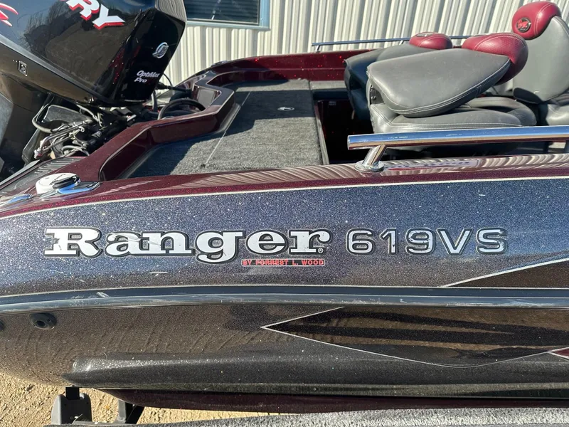 Slide: The Image of 2012 Ranger 619VS boat with Mercury engine, featuring sleek design and comfortable seating. - 2