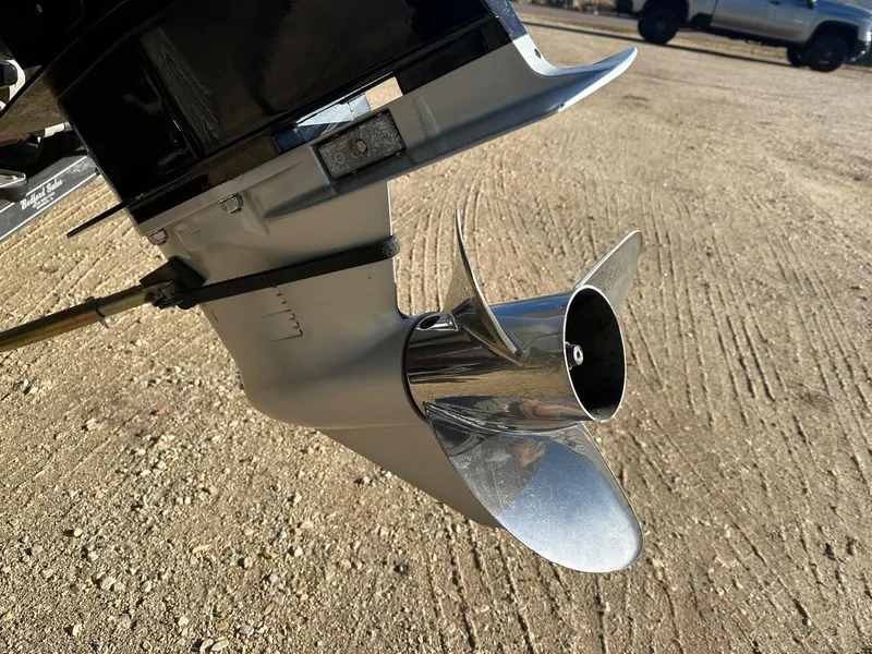 Slide: The Image of Close-up of a 2012 Ranger 619VS boat propeller on a sandy surface. - 25