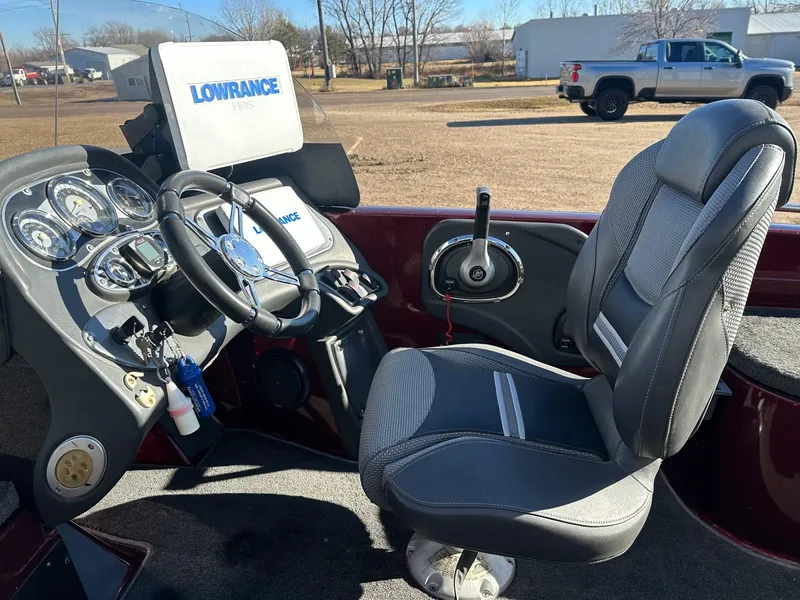Slide: The Image of 2012 Ranger 619VS boat cockpit with steering wheel, gauges, and Lowrance HDS system. - 3