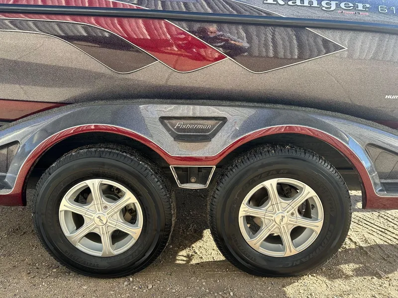 Slide: The Image of 2012 Ranger 619VS boat trailer with dual wheels and "Fisherman" branding. - 40
