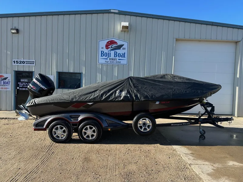 Slide: The Image of 2012 Ranger 619VS boat with cover, parked outside Boji Boat Brokers building. - 41
