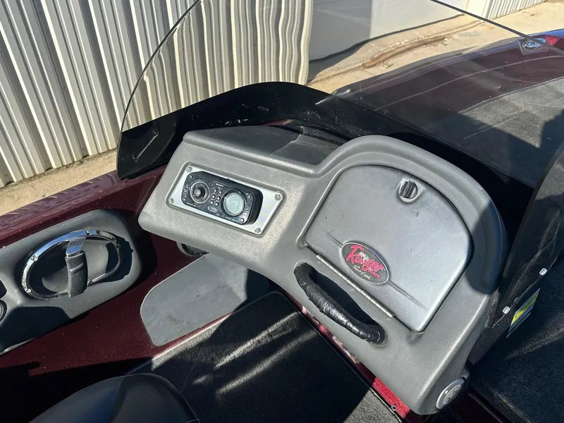 Slide: The Image of 2012 Ranger 619VS boat dashboard with control panel and steering wheel. - 8