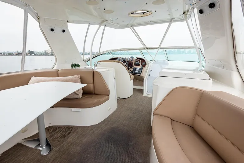 Slide: The Image of Interior of 2005 Carver 560 Voyager yacht with seating and helm. - 13