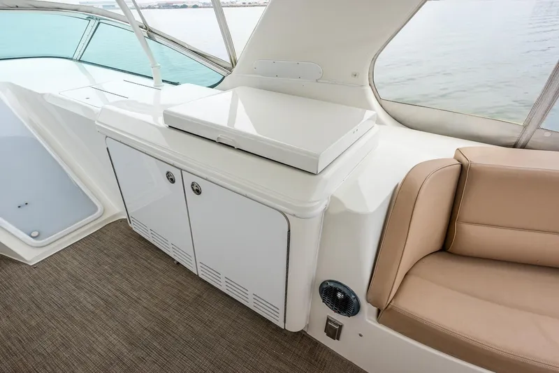 Slide: The Image of Interior of 2005 Carver 560 Voyager yacht with seating and storage cabinets. - 15