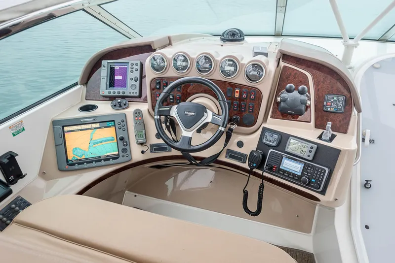 Slide: The Image of 2005 Carver 560 Voyager helm with navigation and control systems. - 18
