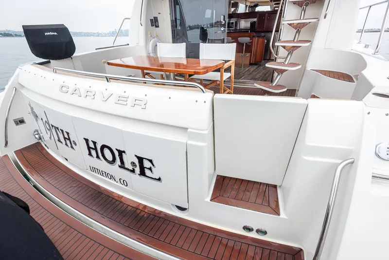 Slide: The Image of 2005 Carver 560 Voyager yacht with elegant deck and seating area. - 29