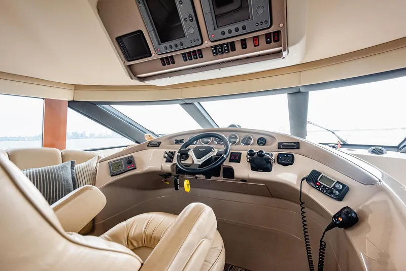 Slide: The Image of Interior helm of 2005 Carver 560 Voyager yacht with modern controls and leather seating. - 36