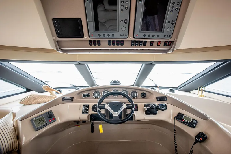 Slide: The Image of Interior helm of 2005 Carver 560 Voyager yacht with modern navigation controls. - 37