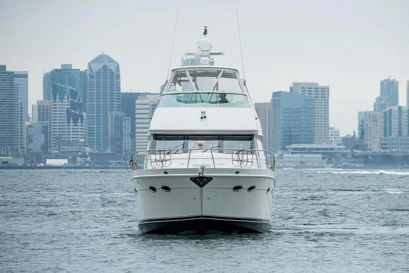 Slide: The Image of 2005 Carver 560 Voyager yacht cruising near city skyline. - 4