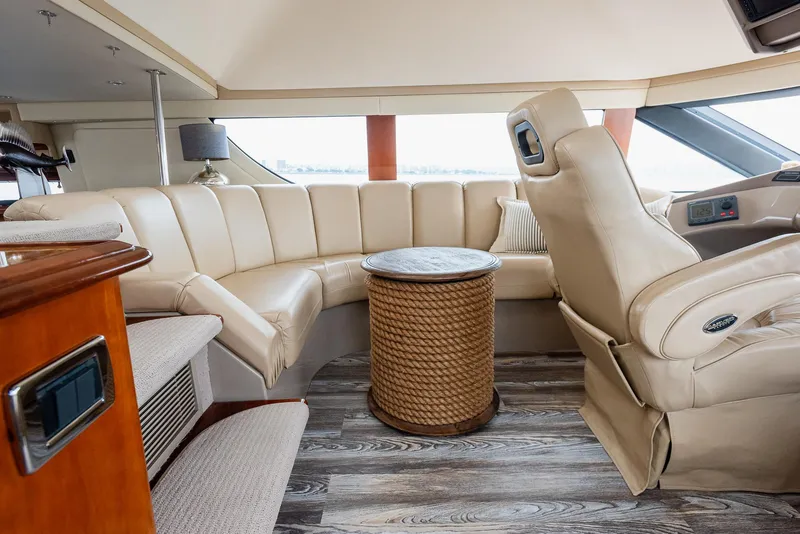 Slide: The Image of Luxurious interior of 2005 Carver 560 Voyager yacht with leather seating and wood flooring. - 40