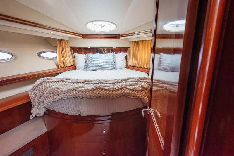 Slide: The Image of Luxurious bedroom interior of 2005 Carver 560 Voyager yacht with cozy bedding. - 42