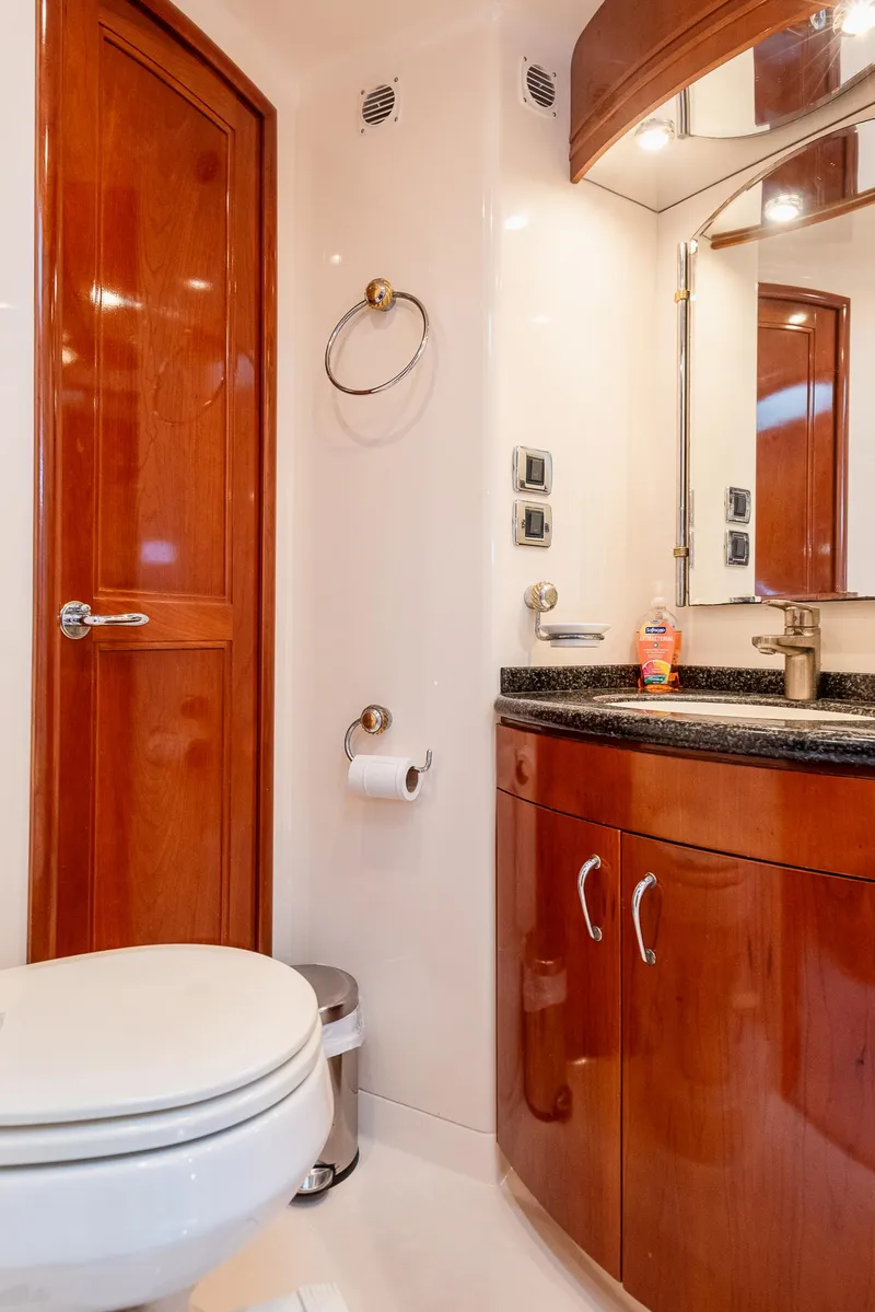 Slide: The Image of Luxurious bathroom in 2005 Carver 560 Voyager yacht with wood cabinetry and modern fixtures. - 45