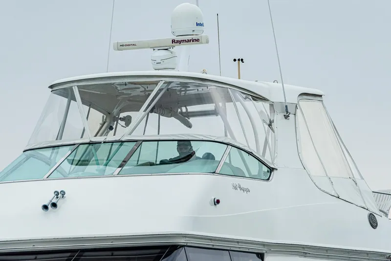 Slide: The Image of 2005 Carver 560 Voyager yacht with radar equipment and enclosed helm. - 5