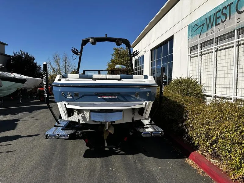 Slide: The Image of 2025 Axis A225 boat parked outside West Coast Boat Center. - 3