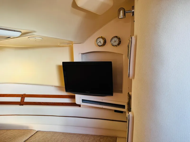 Slide: The Image of Interior of 2005 Grady-White Marlin 300 boat with TV and gauges. - 12