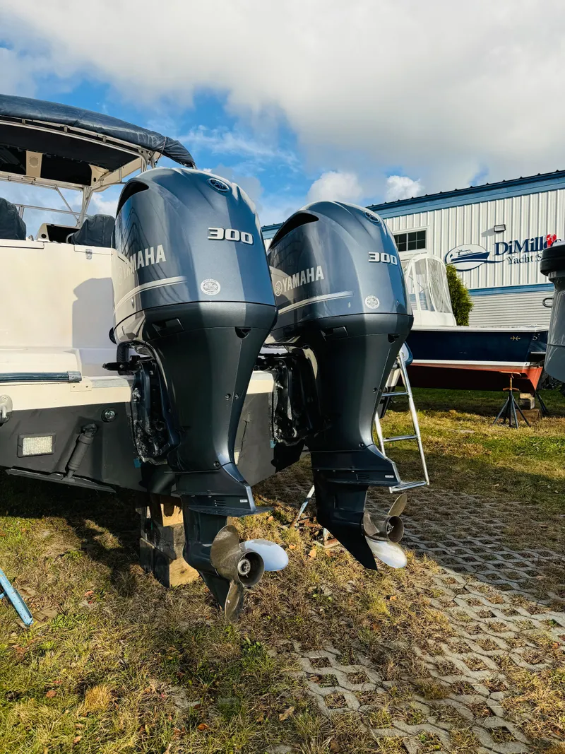 Slide: The Image of 2005 Grady-White Marlin 300 with twin Yamaha 300 outboard engines, parked outdoors. - 16