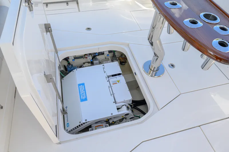 Slide: The Image of 2023 SeaVee 420Z boat deck with open hatch revealing engine compartment. - 27