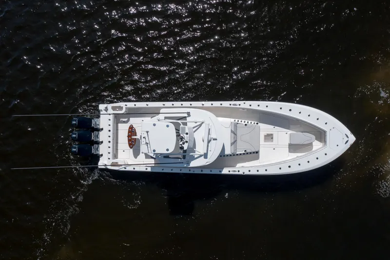Slide: The Image of Aerial view of 2023 SeaVee 420Z boat on dark water. - 4