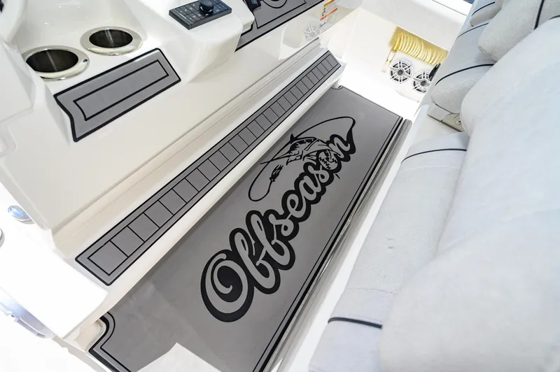 Slide: The Image of 2023 SeaVee 420Z boat interior with "Offseason" mat and cup holders. - 8