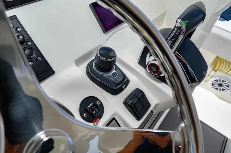 Slide: The Image of Close-up of 2023 SeaVee 420Z boat controls and steering wheel. - 9