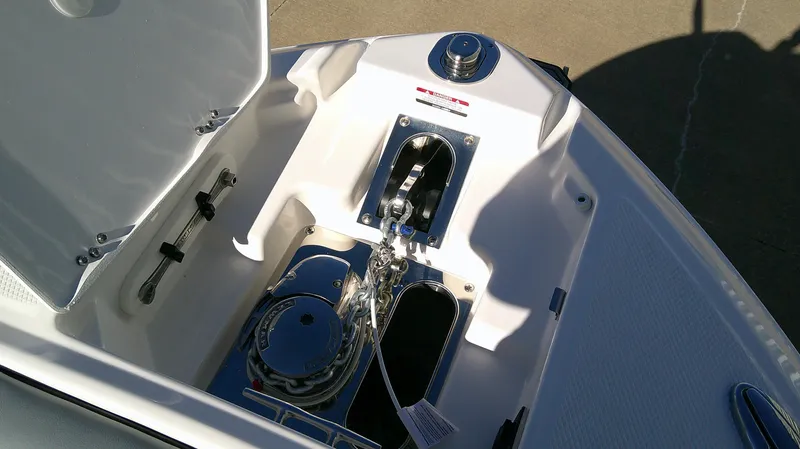 Slide: The Image of Anchor compartment of 2025 Chaparral 28 Surf boat, featuring modern design and equipment. - 13