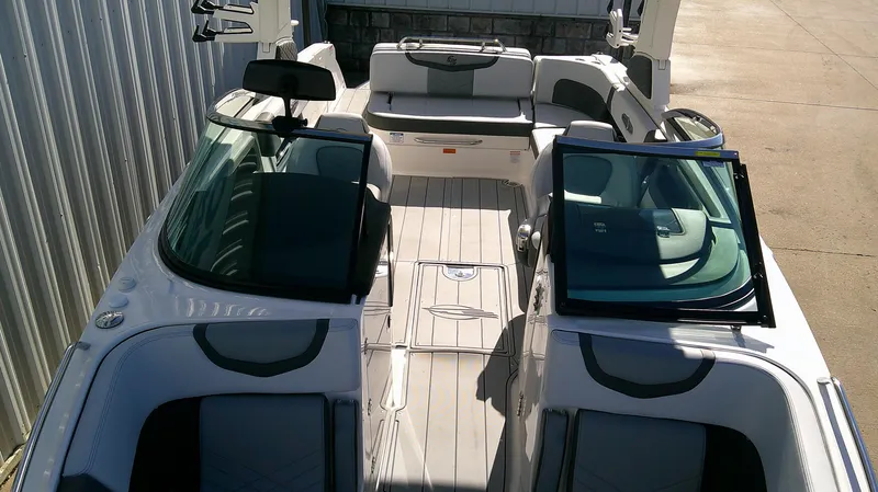 Slide: The Image of 2025 Chaparral 28 Surf boat interior with seating and open deck layout. - 14