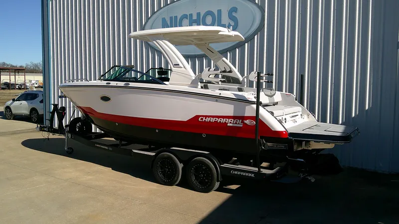 Slide: The Image of 2025 Chaparral 28 Surf boat on trailer outside Nichols dealership. - 3