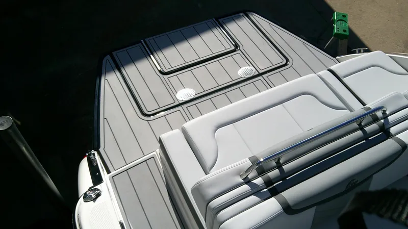 Slide: The Image of 2025 Chaparral 28 Surf boat deck with sleek, modern design and comfortable seating. - 4