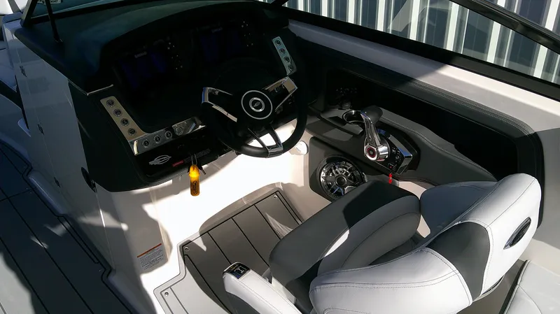 Slide: The Image of Interior cockpit of 2025 Chaparral 28 Surf boat with steering wheel and controls. - 8