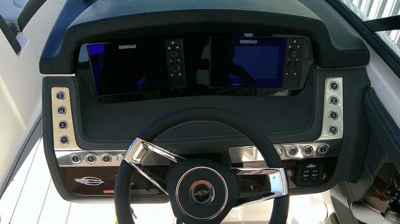 Slide: The Image of Dashboard of 2025 Chaparral 28 Surf boat with dual Simrad displays. - 9