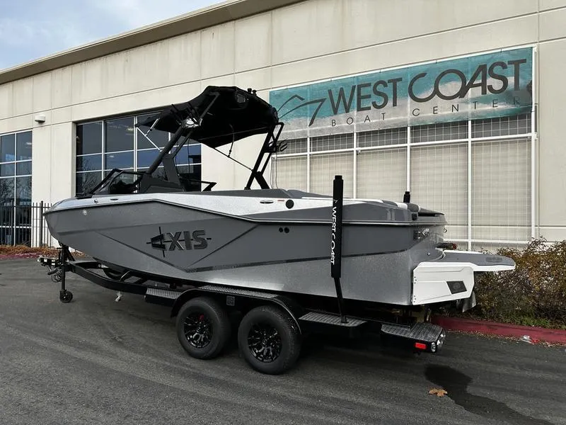 Slide: The Image of 2025 Axis T220 boat on trailer at West Coast Boat Center. - 2