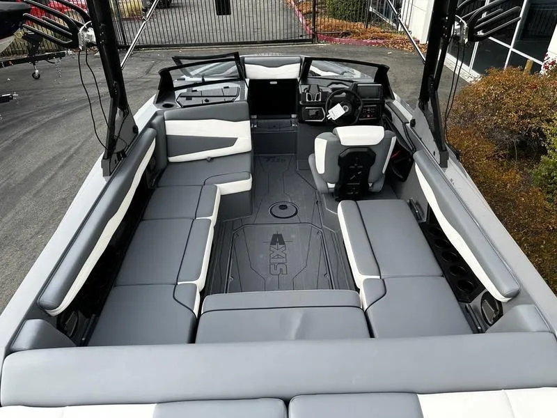 Slide: The Image of 2025 Axis T220 boat interior with spacious seating and modern dashboard design. - 4