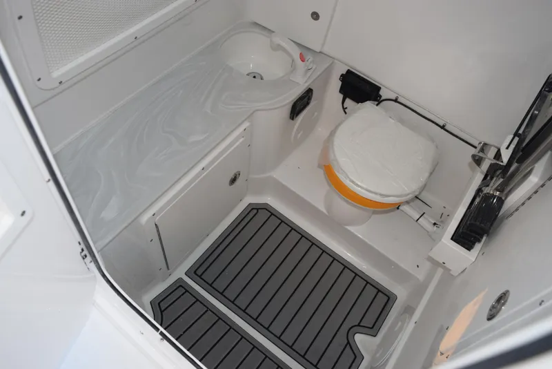 Slide: The Image of 2025 Sea Hunt Gamefish 28 boat bathroom with sink and toilet. - 16