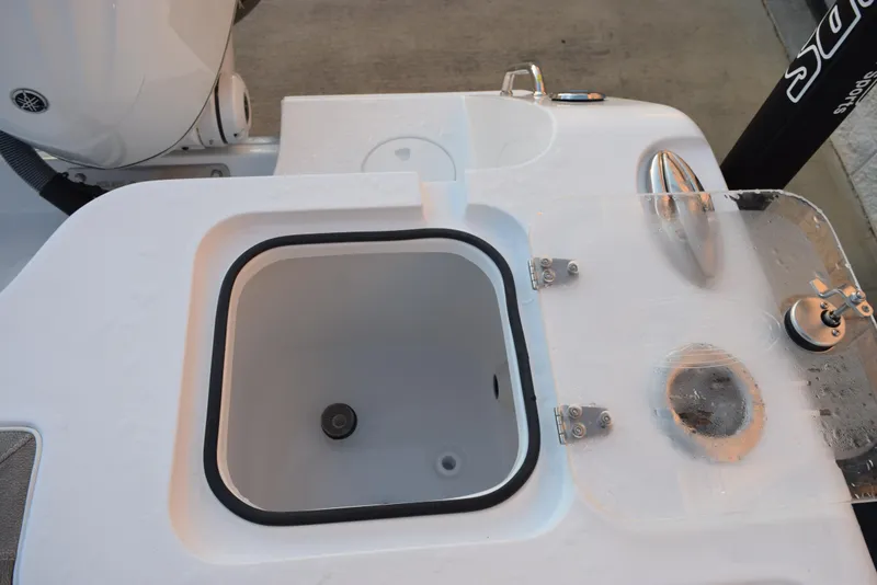 Slide: The Image of 2025 Sea Hunt Gamefish 28 boat deck with livewell and fishing equipment. - 23