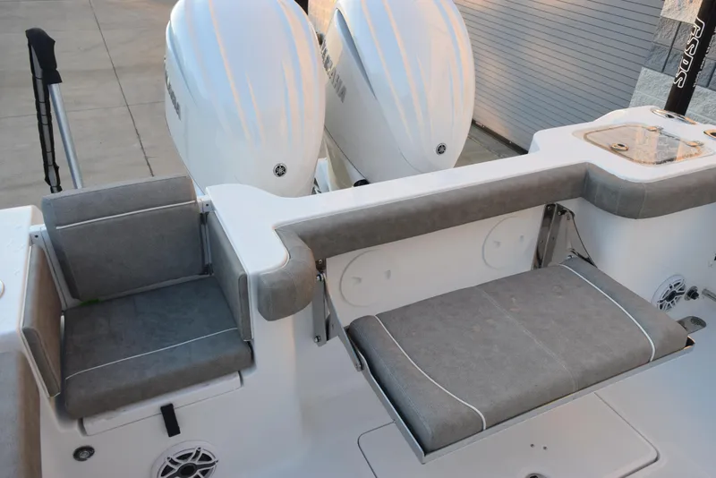 Slide: The Image of 2025 Sea Hunt Gamefish 28 boat with dual engines and cushioned seating. - 8