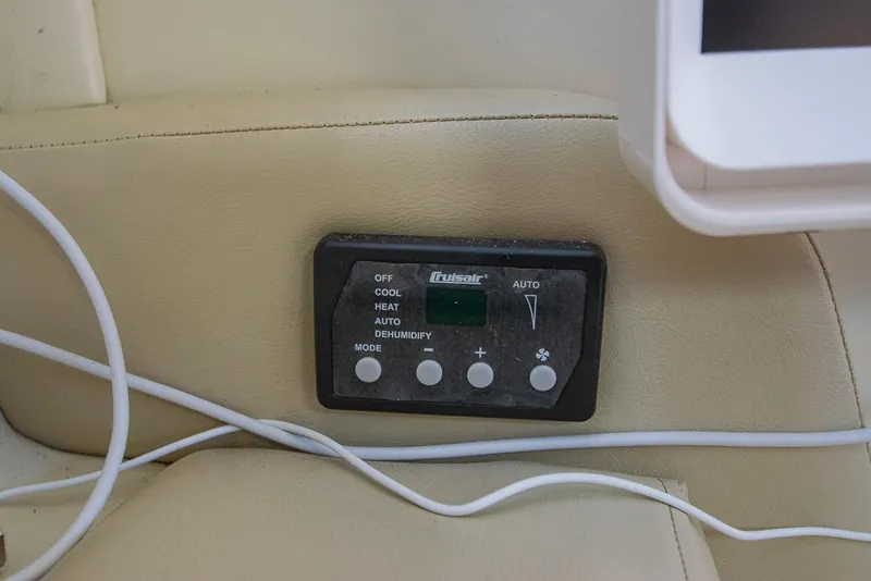 Slide: The Image of Control panel on a 2010 Bayliner 2450 Ciera boat interior. - 14