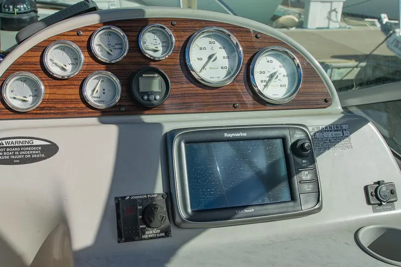 Slide: The Image of Dashboard of a 2010 Bayliner 2450 Ciera boat with gauges and navigation system. - 24