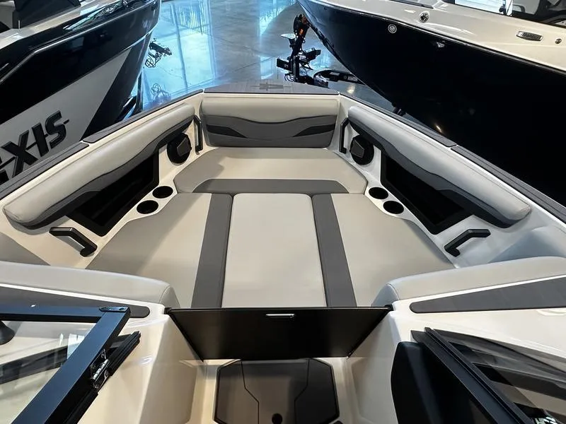 Slide: The Image of 2025 Axis T235 boat interior with sleek seating and cup holders. - 6
