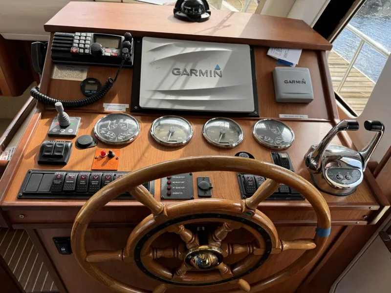 Slide: The Image of Control panel of 2008 Mainship 34 Trawler Hardtop with Garmin navigation system. - 13