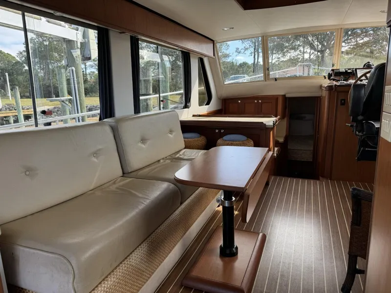Slide: The Image of Interior of 2008 Mainship 34 Trawler Hardtop with seating and table. - 3