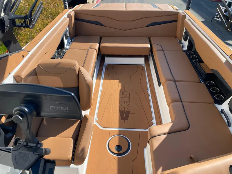 Slide: The Image of Luxurious interior of 2025 Axis T235 boat with tan seating and modern design. - 6