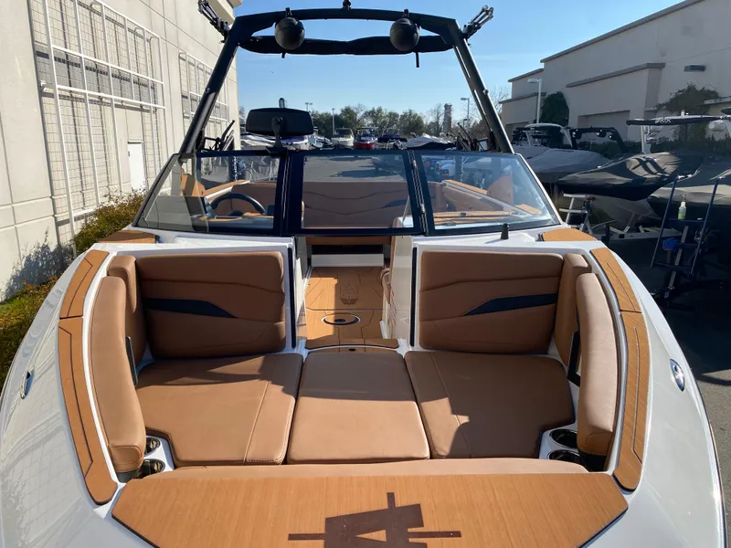 Slide: The Image of 2025 Axis T235 boat interior with tan seating and sleek design. - 9